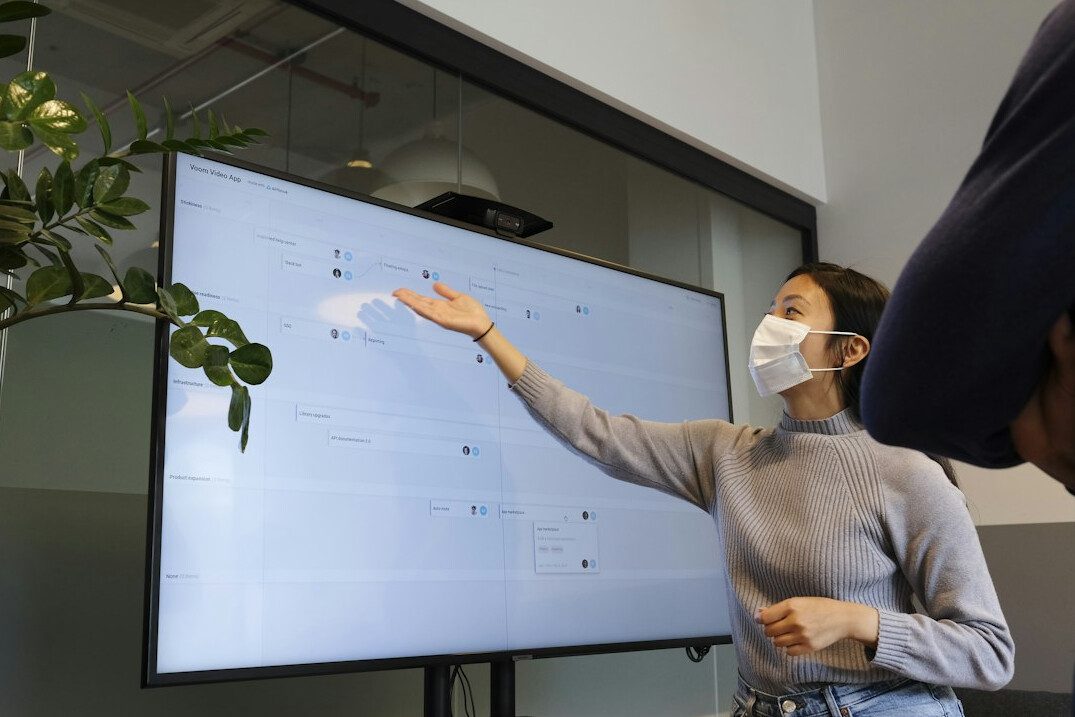 woman presenting to audience