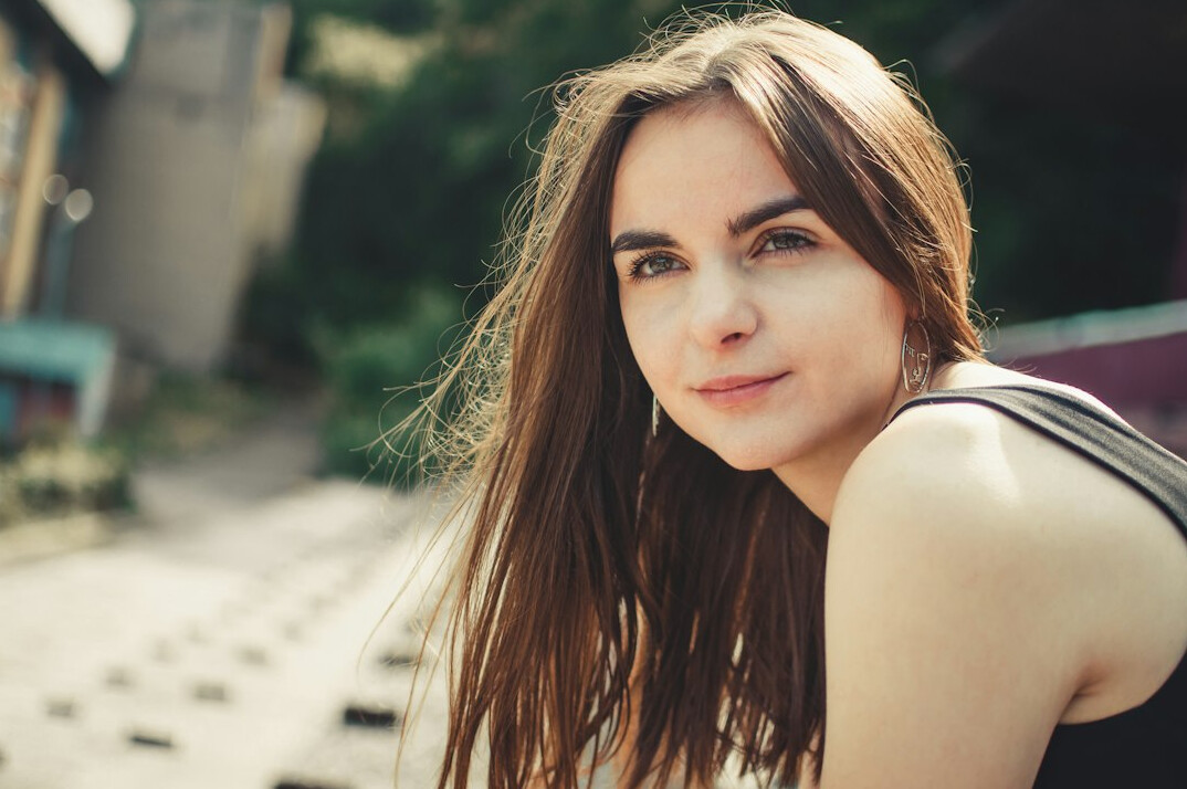 Portrait of a smiling young woman with long hair